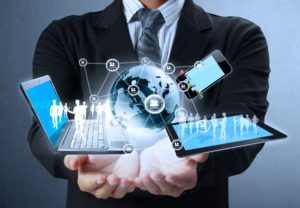 Businessman presenting digital network, globe, and devices